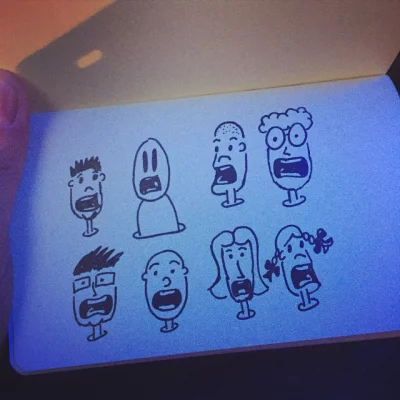 Drawing crying heads while waiting on the bus